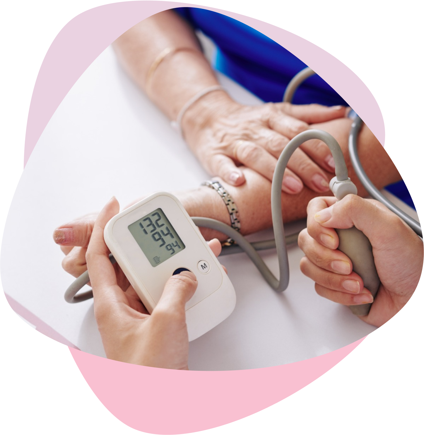 Measuring blood pressure of an elderly woman