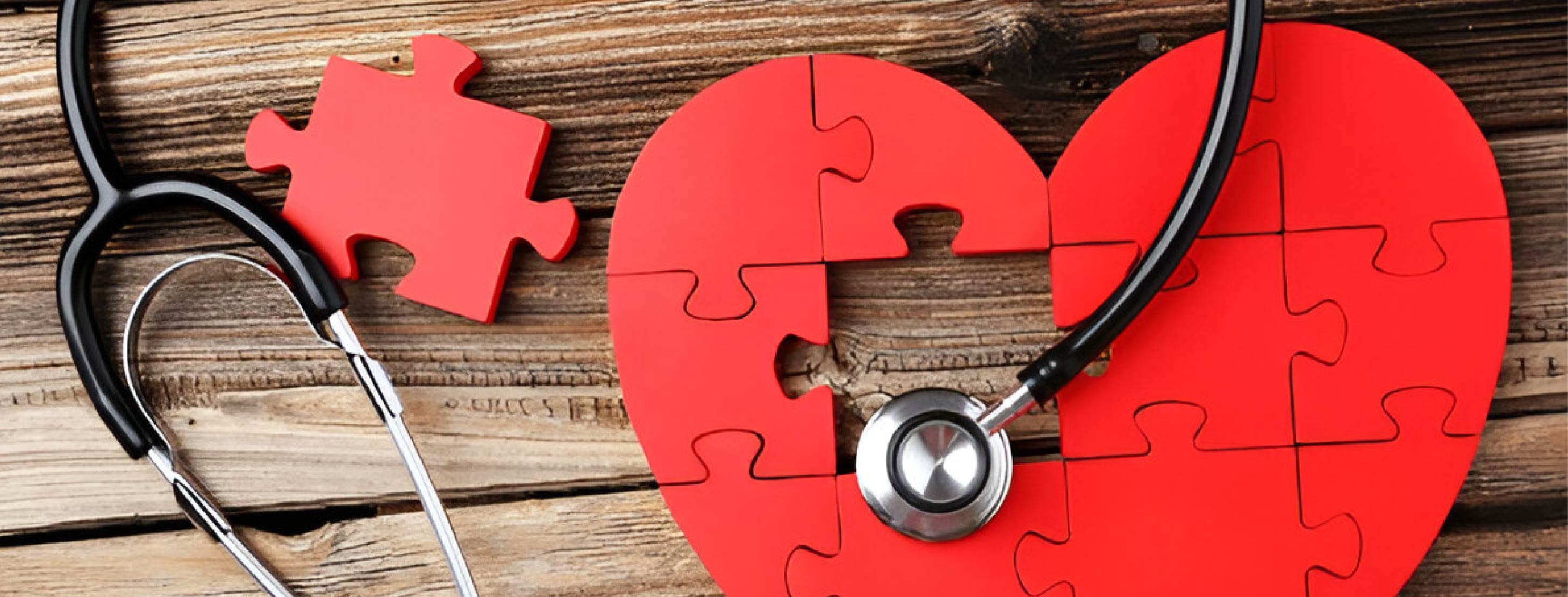 red puzzle heart with a stethoscope