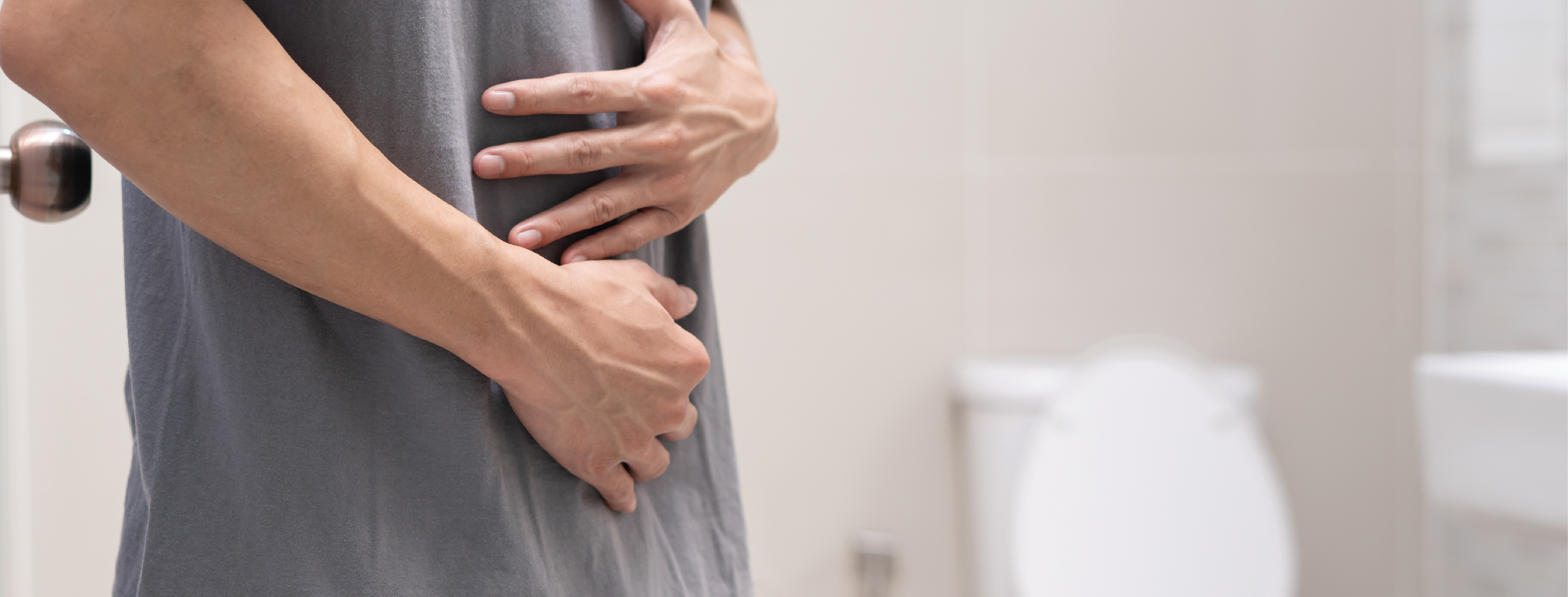 man touching his stomach having diarrhea